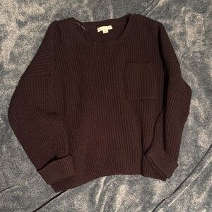 Cozy Black Ribbed Knit Sweater with Front Pocket